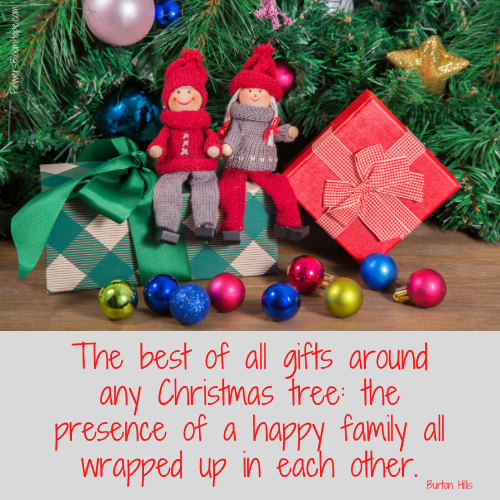 The best of all gifts around any Christmas tree: the presence of a happy family all wrapped up in each other.